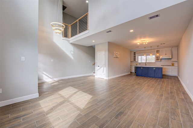 unfurnished living room with sink