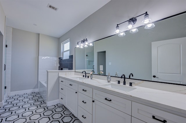 bathroom with tile patterned floors, vanity, and plus walk in shower