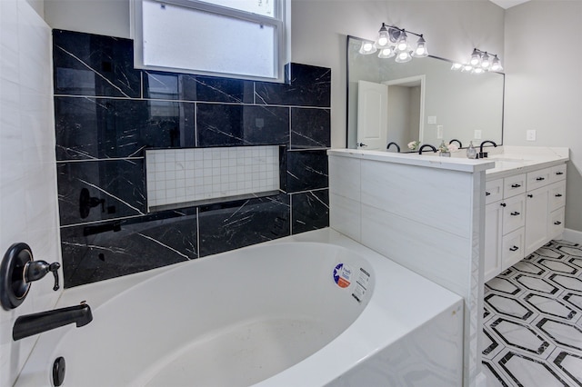 bathroom with a tub to relax in and vanity