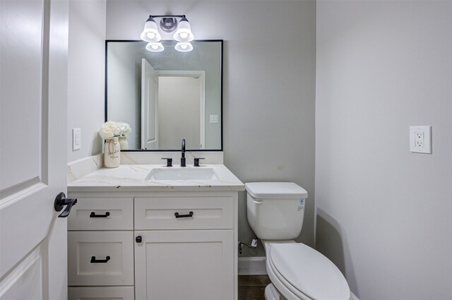 bathroom with toilet and vanity