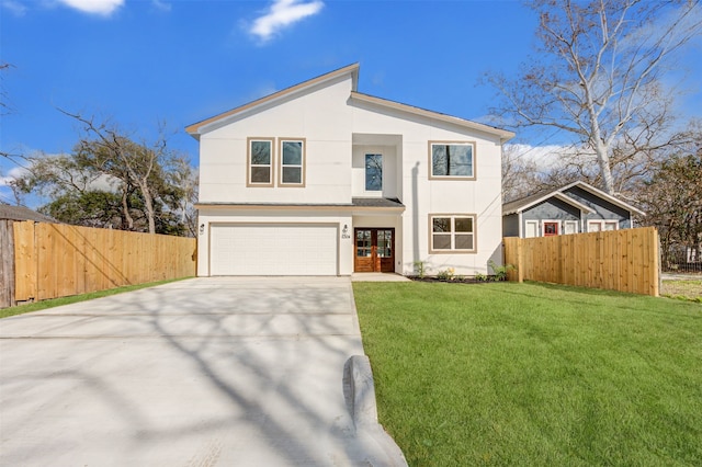 view of front of property with a front lawn, a garage, and french doors