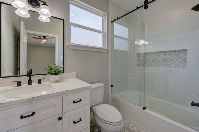 full bathroom with toilet, ceiling fan, vanity, and bath / shower combo with glass door