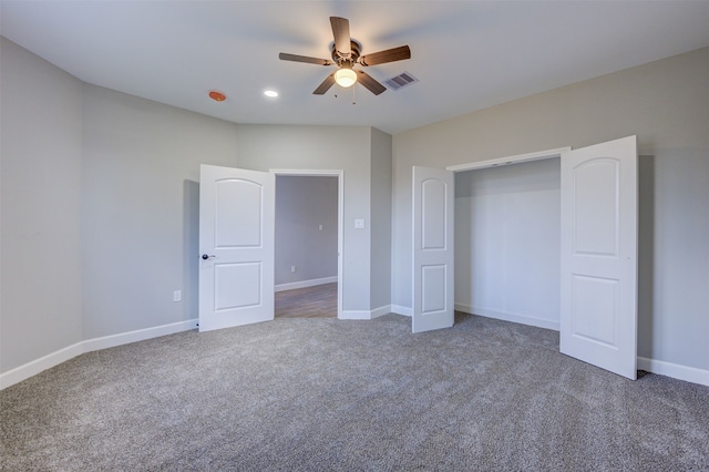 unfurnished bedroom featuring ceiling fan, a closet, and carpet floors