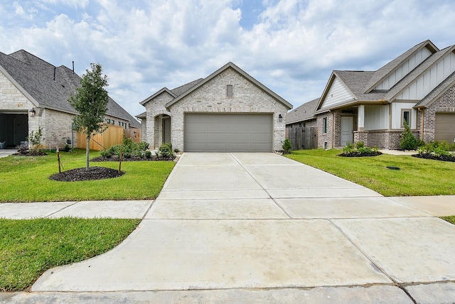 view of front of house featuring a garage and a front yard