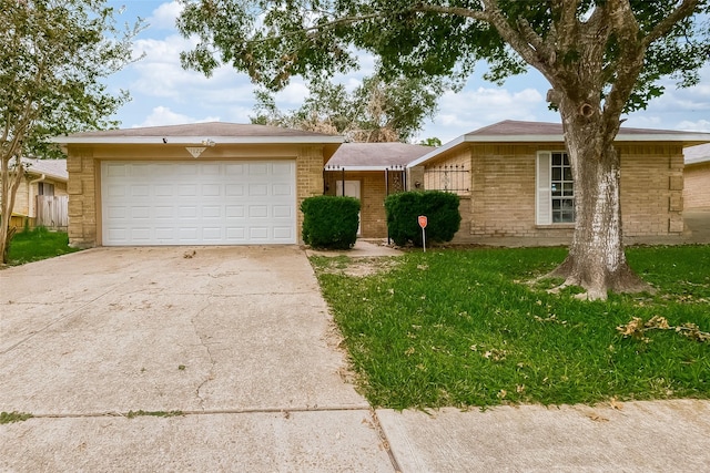 ranch-style home with a garage and a front lawn