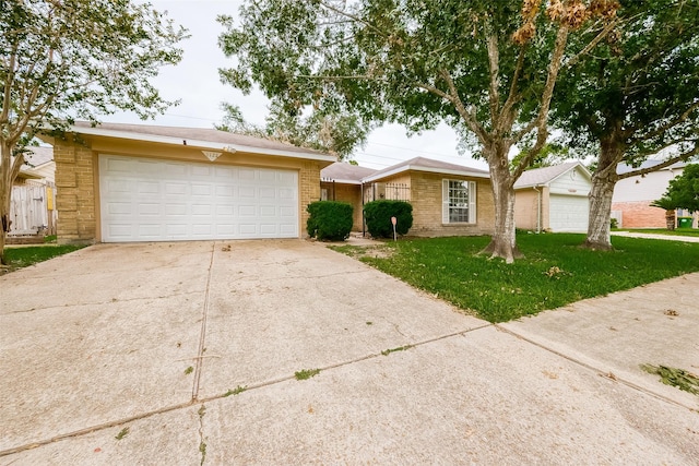 single story home featuring a front lawn and a garage