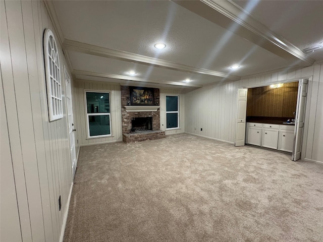 unfurnished living room featuring wood walls and light colored carpet