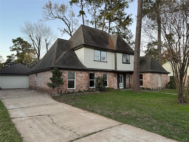 view of front facade with a front yard and a garage