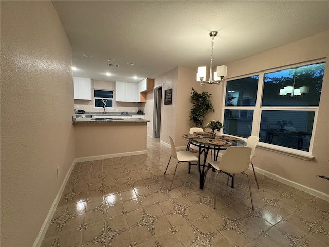 dining area featuring a chandelier