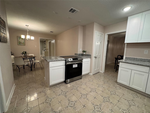 kitchen featuring electric range, a notable chandelier, stone counters, white cabinetry, and hanging light fixtures