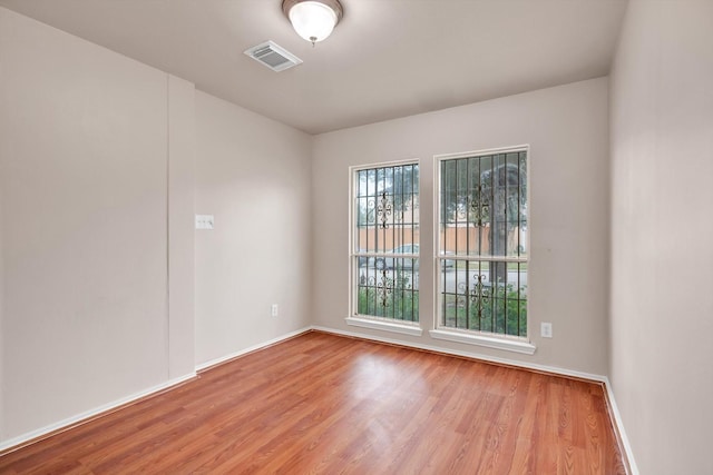 spare room featuring light hardwood / wood-style flooring