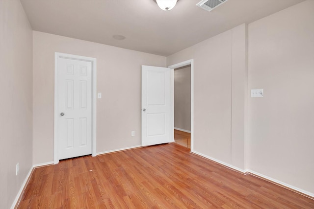 unfurnished bedroom with light hardwood / wood-style floors