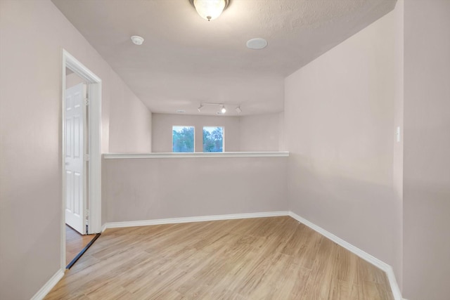 spare room featuring light hardwood / wood-style flooring