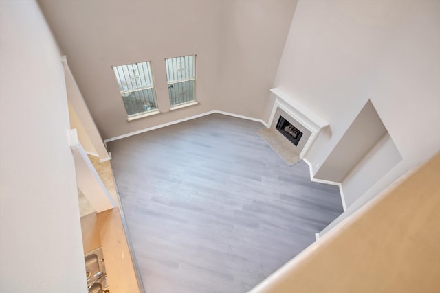 unfurnished living room with dark hardwood / wood-style floors