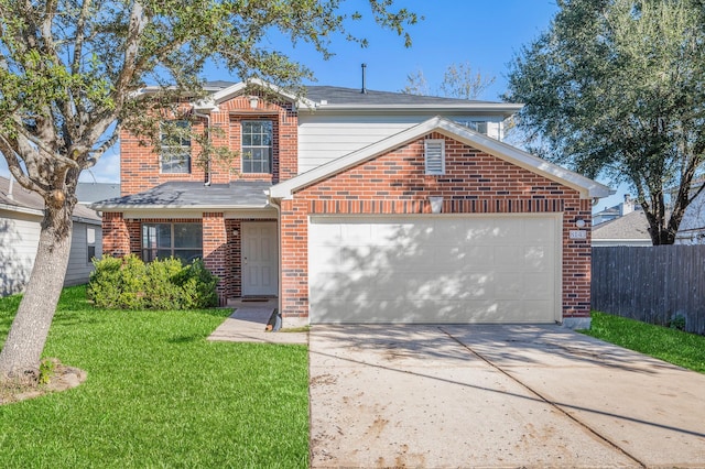 view of property featuring a front yard and a garage