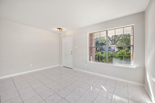 view of tiled spare room