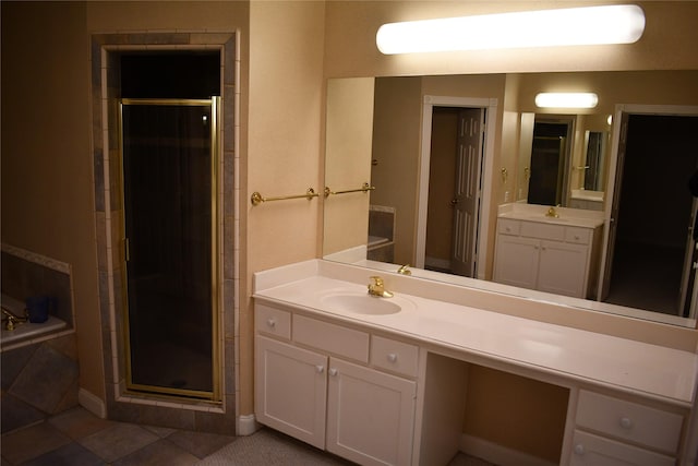 bathroom with vanity, tile patterned floors, and a shower with shower door