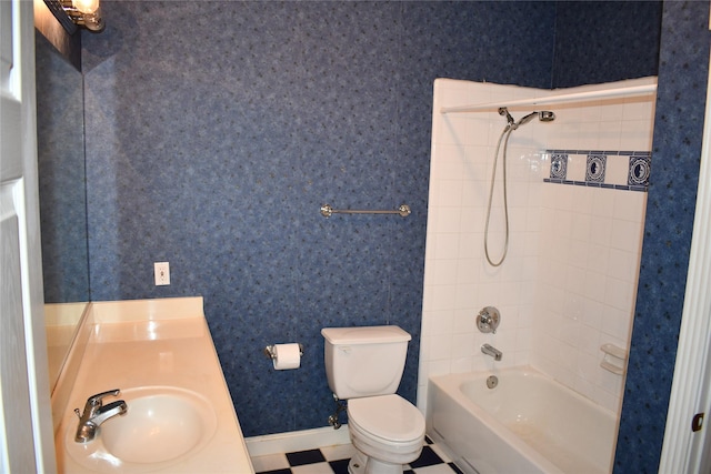 full bathroom featuring vanity, toilet, and tiled shower / bath