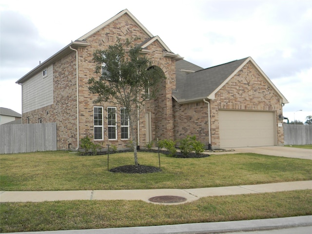 view of front facade with a garage and a front lawn