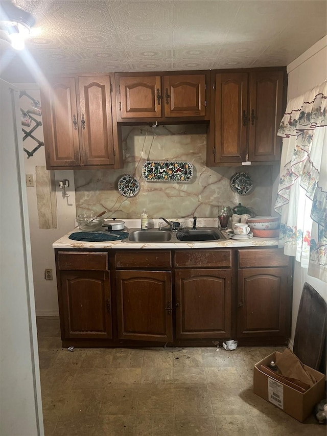 kitchen featuring decorative backsplash and sink