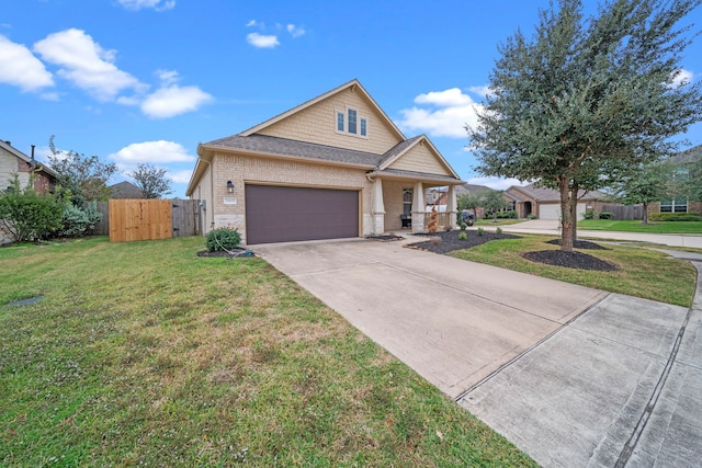 view of front of home with a garage and a front lawn