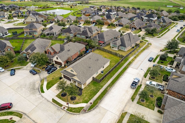 bird's eye view with a residential view and a water view