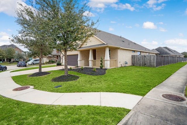 view of home's exterior with brick siding, fence, roof with shingles, a lawn, and a garage