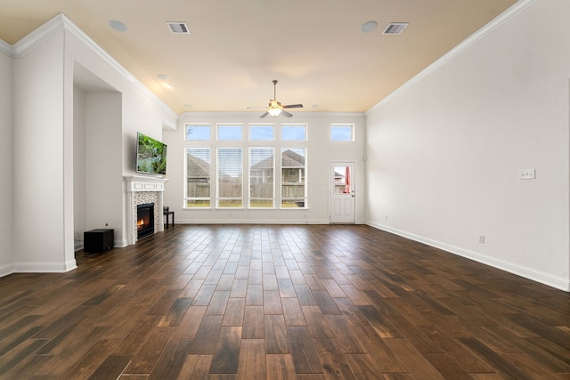 unfurnished living room with dark wood-style floors, visible vents, and a ceiling fan