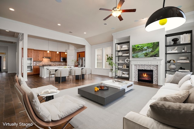 living room with recessed lighting, dark wood finished floors, and crown molding