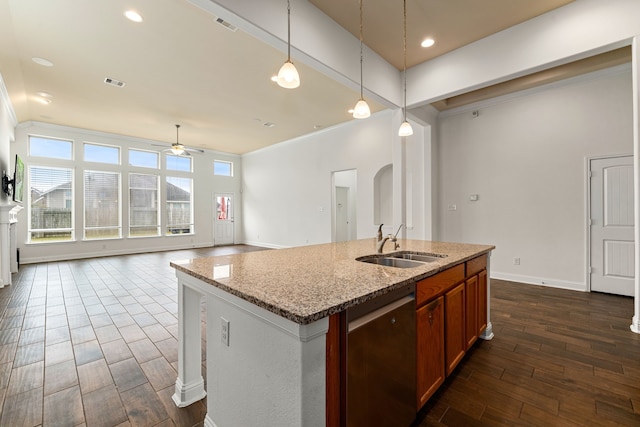 kitchen with stainless steel dishwasher, ornamental molding, visible vents, and a sink