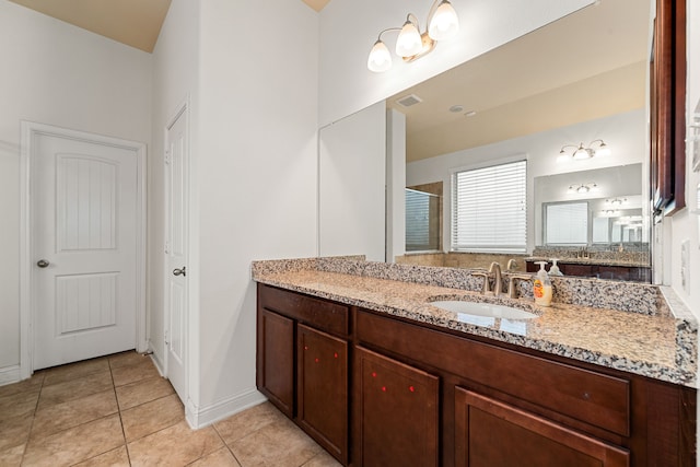 full bath featuring tile patterned flooring, visible vents, a shower stall, and vanity