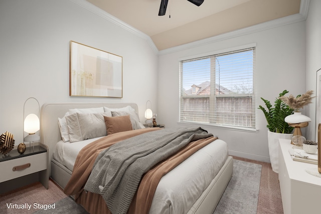 bedroom featuring crown molding, baseboards, lofted ceiling, carpet flooring, and a ceiling fan