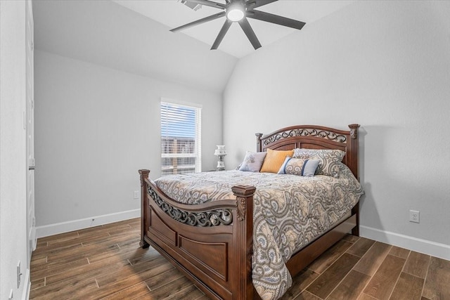 bedroom with wood finish floors, vaulted ceiling, and baseboards