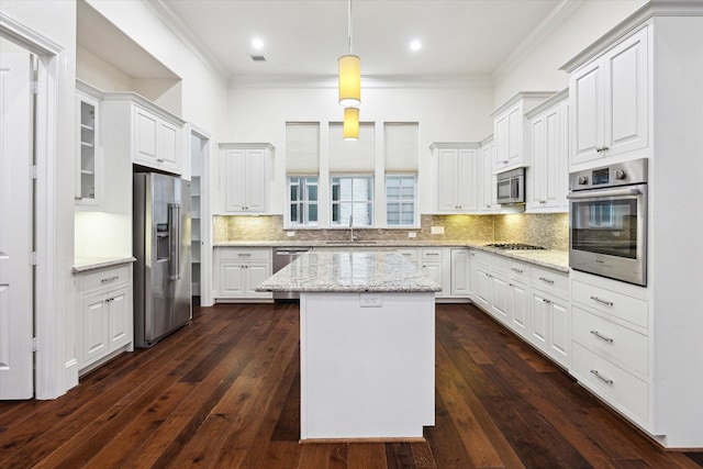 kitchen featuring a center island, white cabinets, and appliances with stainless steel finishes