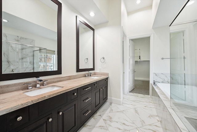 bathroom with separate shower and tub and vanity