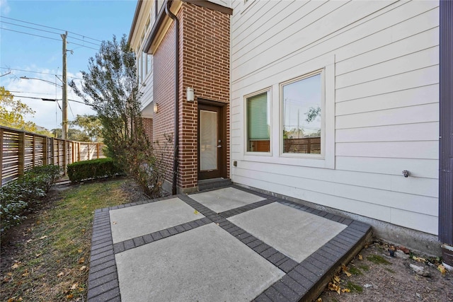 entrance to property with a patio area