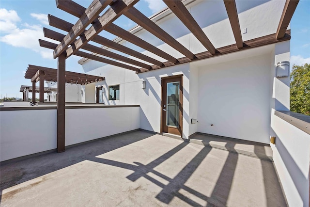 view of patio featuring a pergola and an outdoor bar