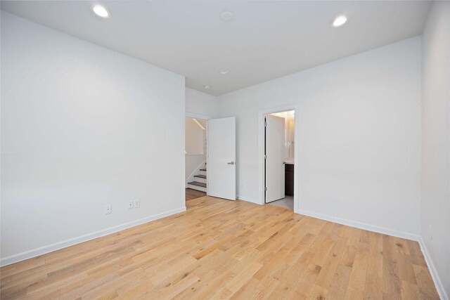 spare room with light hardwood / wood-style floors