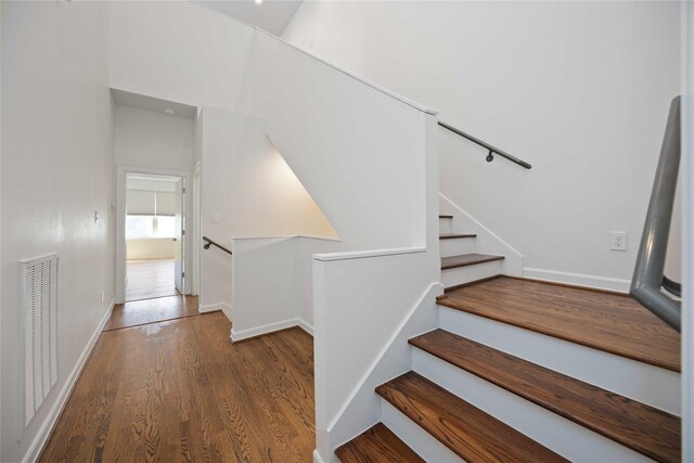 stairway with wood-type flooring