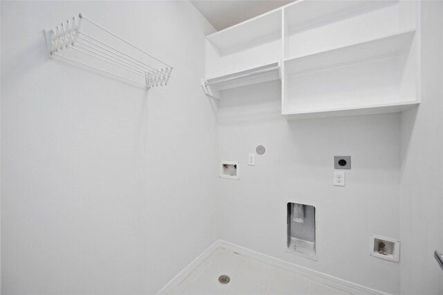 washroom with washer hookup, electric dryer hookup, hookup for a gas dryer, and tile patterned floors