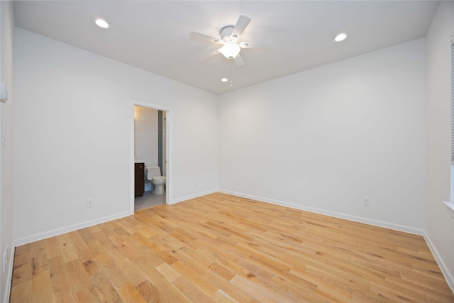 unfurnished room featuring ceiling fan and light hardwood / wood-style floors