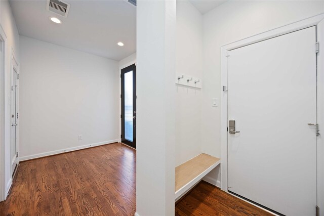 foyer entrance with dark hardwood / wood-style floors