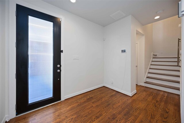 entryway with dark wood-type flooring