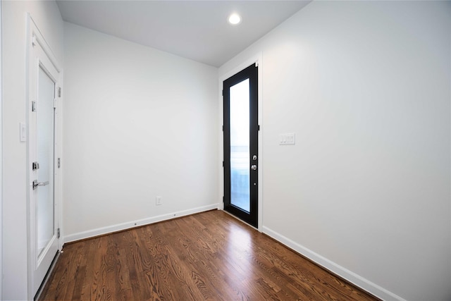 foyer entrance with dark hardwood / wood-style flooring