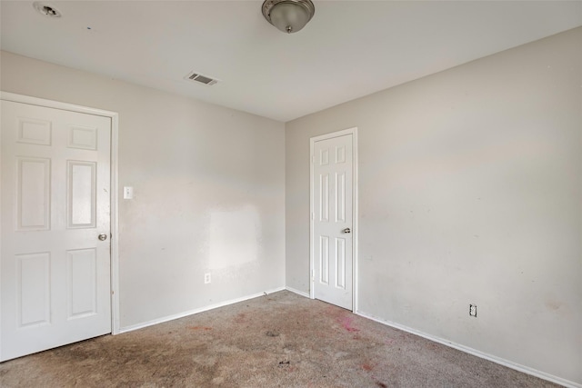 empty room featuring carpet flooring