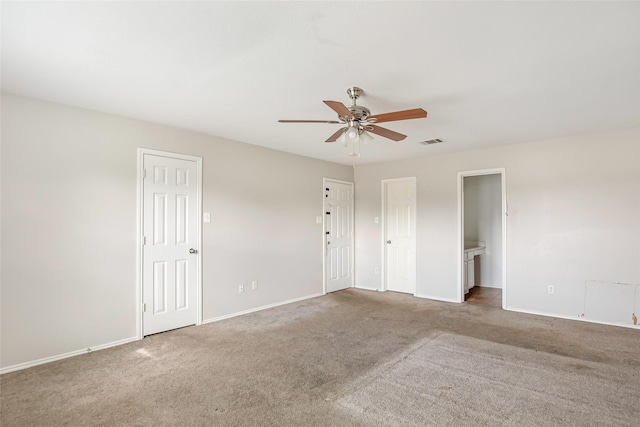 spare room with carpet and ceiling fan