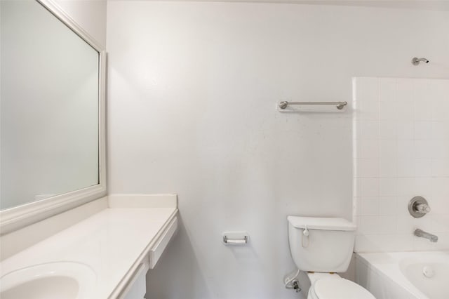 full bathroom with vanity, toilet, and tiled shower / bath