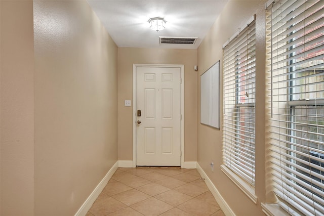 doorway featuring light tile patterned floors