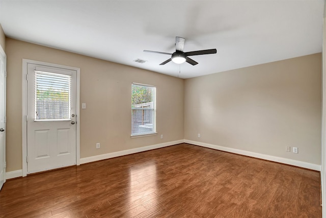 spare room featuring ceiling fan and hardwood / wood-style flooring