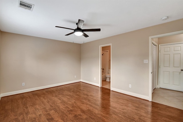 unfurnished room featuring ceiling fan and hardwood / wood-style flooring